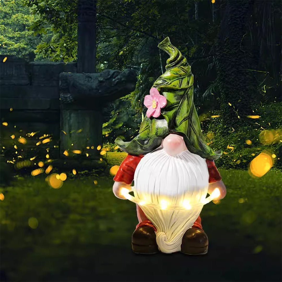 Gnome garden light with glowing belly illumination during daytime and nighttime comparison