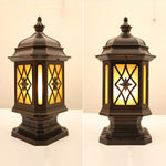 Traditional lantern-style post cap light with diamond lattice glass pattern mounted on wooden fence post
