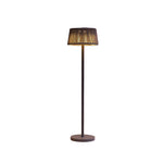 Elegant solar floor lamp with woven rattan shade and dark metal pole against white background