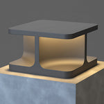 Contemporary cubic post light with dual-tone finish creating ambient illumination in modern setting