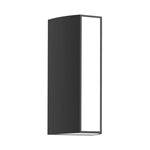 Outdoor wall light casting warm golden glow on brick surface with dramatic shadow effects