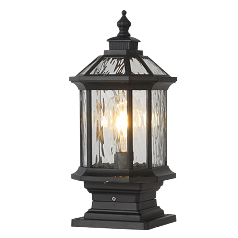 Classic outdoor pillar light with transparent glass housing and traditional black metal framework