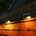 Wooden deck railing enhanced with warm LED strip lighting creating cozy outdoor ambiance during rainfall