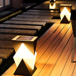 Modern angular post light with geometric V-shaped design creating dramatic upward and downward illumination