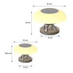 Modern circular bollard light with dome top and cylindrical base creating gentle ambient illumination for landscapes
