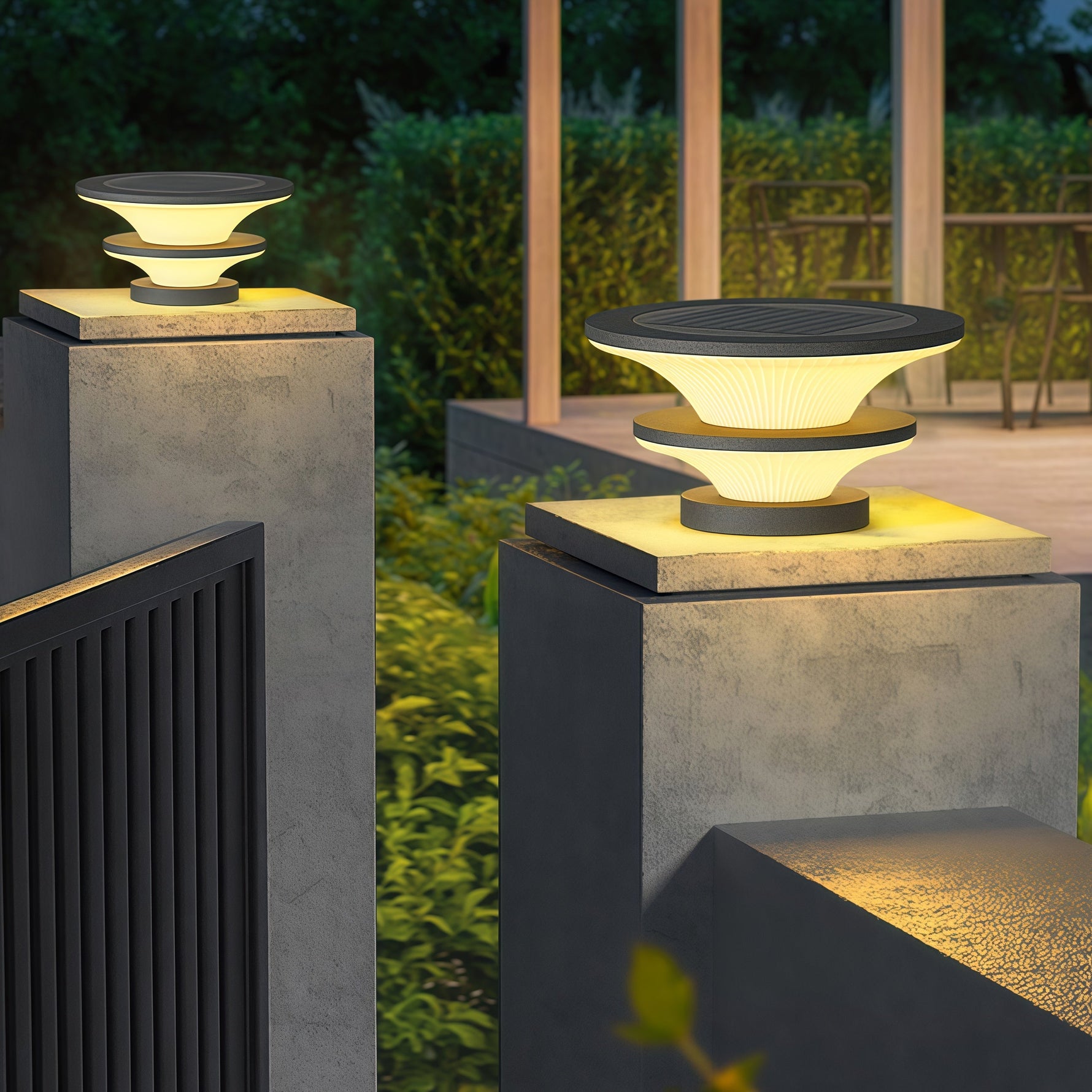 Architectural post lighting installation featuring geometric stacked elements in residential garden setting at twilight