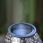 Close-up view of solar panel integrated into decorative lamp base showing renewable energy technology