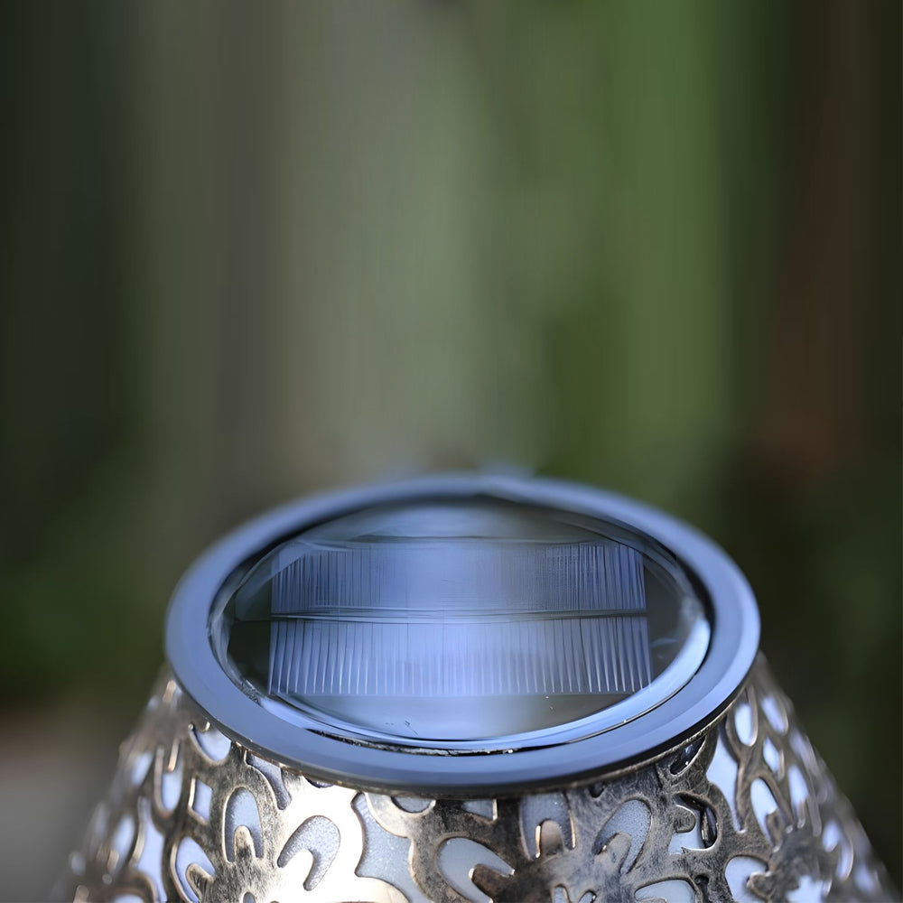 Close-up view of solar panel integrated into decorative lamp base showing renewable energy technology