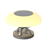 Modern circular bollard light with dome top and cylindrical base creating gentle ambient illumination for landscapes
