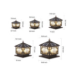 Pagoda-style outdoor lantern photographed in natural garden setting with stone base