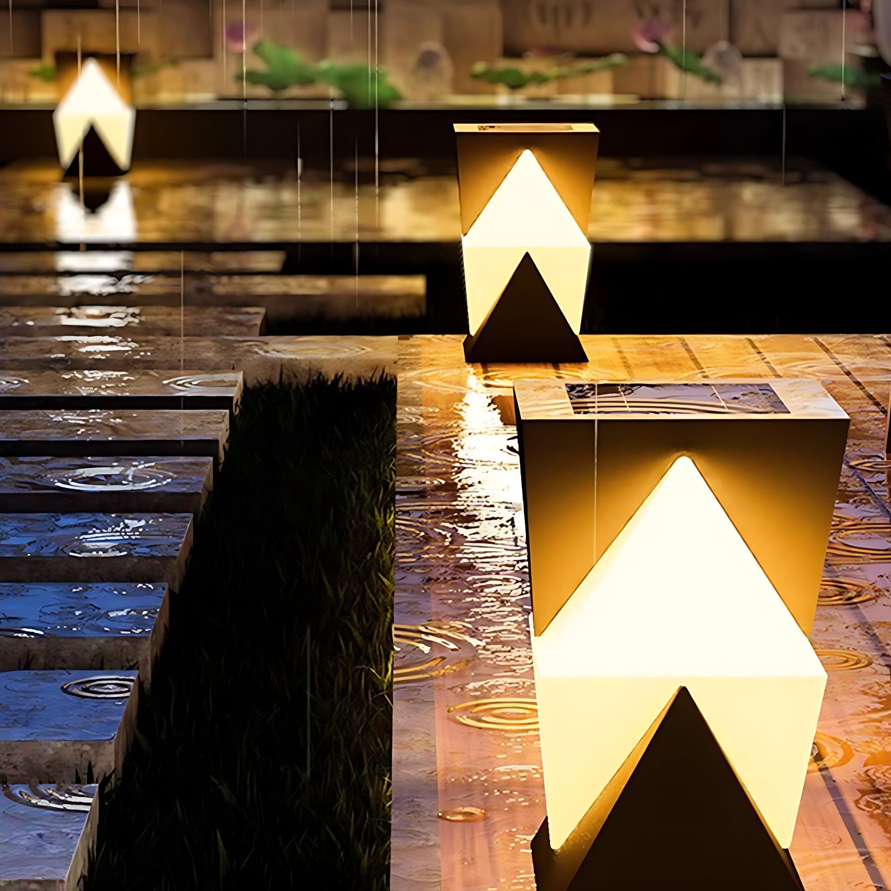 Modern angular post light with geometric V-shaped design creating dramatic upward and downward illumination
