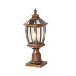 Antique-style bronze column lamp with curved glass panels and ornamental base detailing