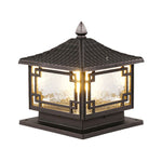 Traditional black lantern-style outdoor light fixture with glass panels and ornate metal framework