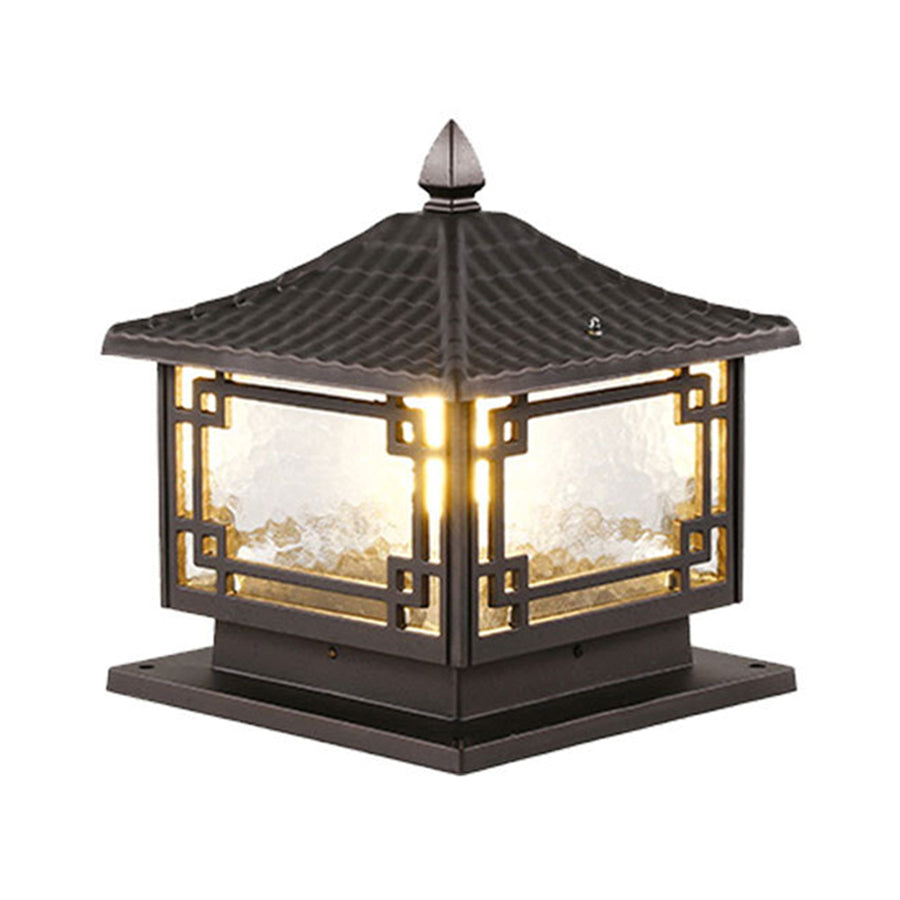 Traditional black lantern-style outdoor light fixture with glass panels and ornate metal framework