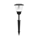 Black solar garden light with white lantern head and ground stake for outdoor pathway illumination