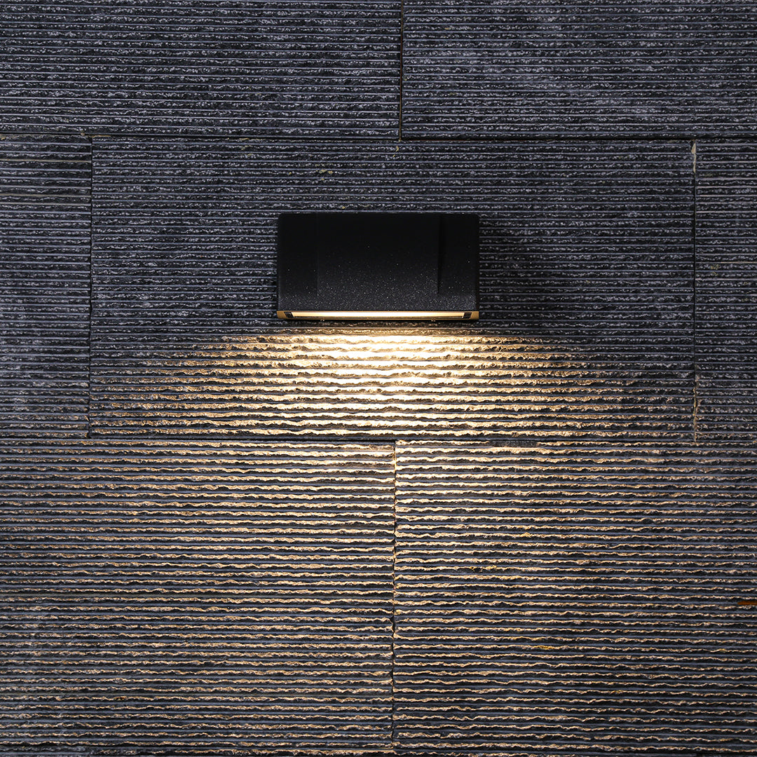 Textured brick surface with contemporary lighting creating dramatic shadows and architectural depth
