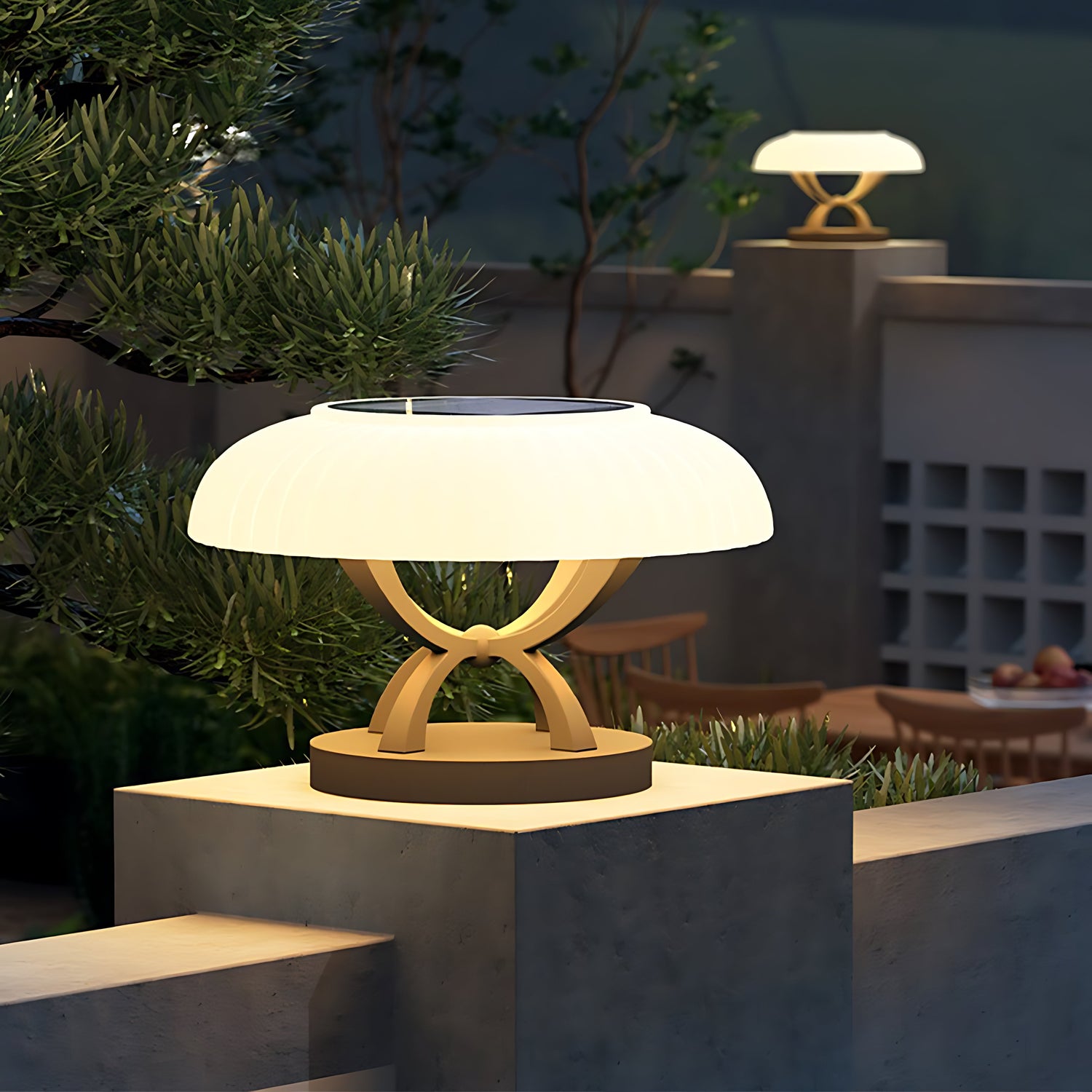 Modern circular bollard light with dome top and cylindrical base creating gentle ambient illumination for landscapes