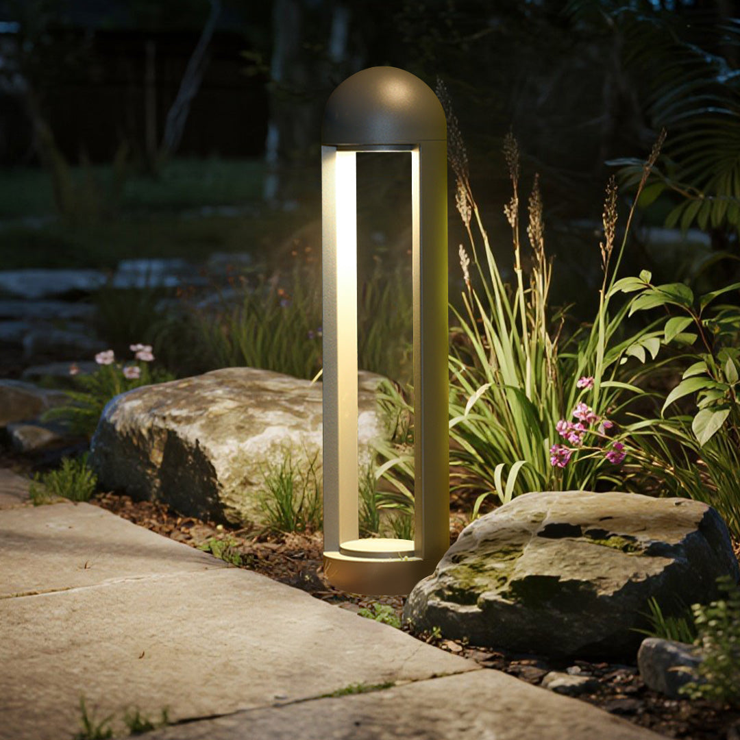 Sleek bollard lights illuminating coastal pathway with scenic mountain backdrop