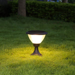 Elegant post lights illuminating commercial plaza walkway during evening hours