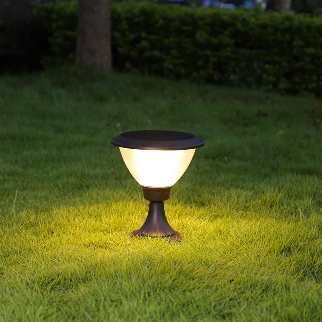 Elegant post lights illuminating commercial plaza walkway during evening hours