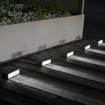 Professional step light installation on concrete stairs showing recessed mounting technique