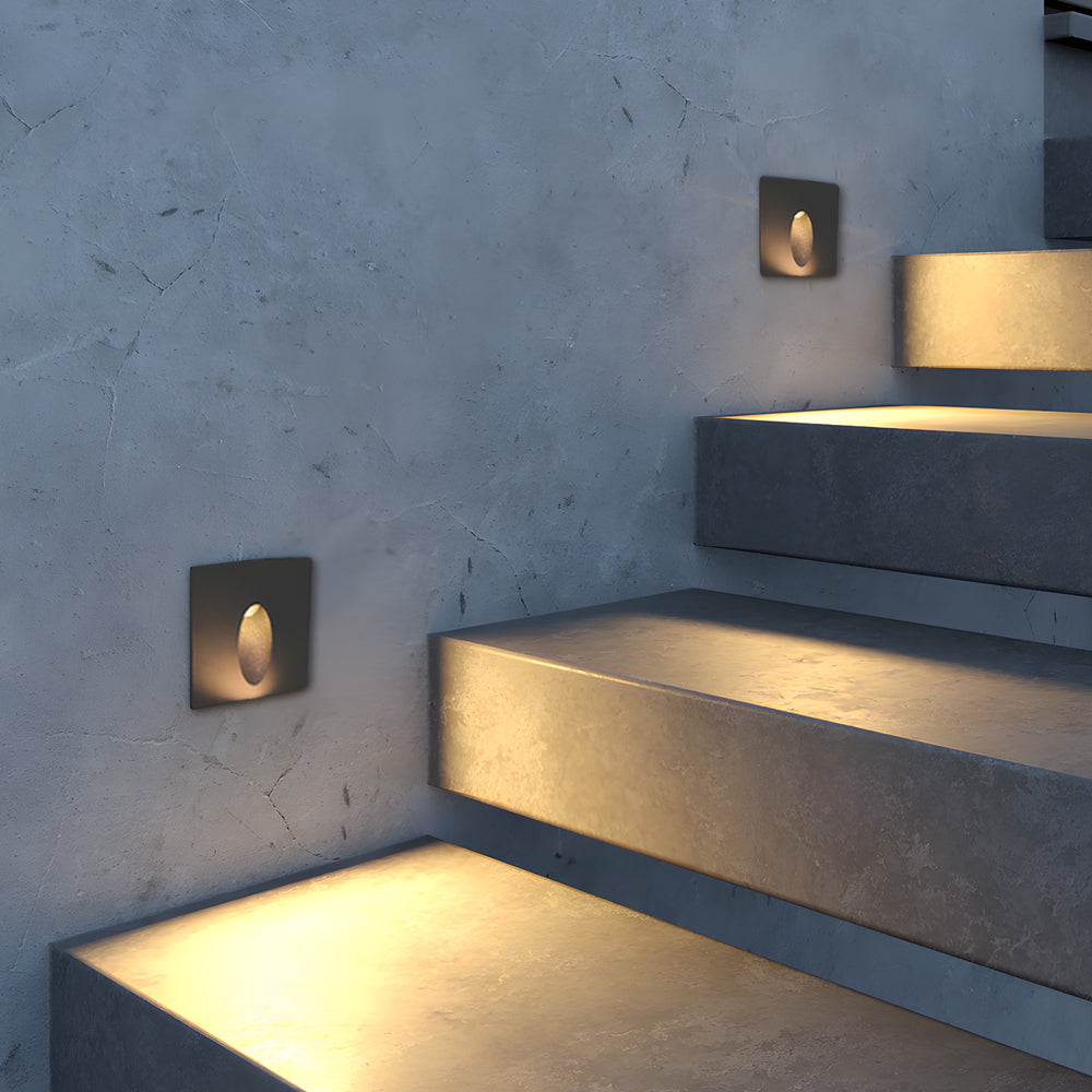 Concrete stairway with built-in recessed lighting fixtures providing safety illumination