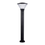 Bollard light providing warm ambient lighting along curved residential walkway