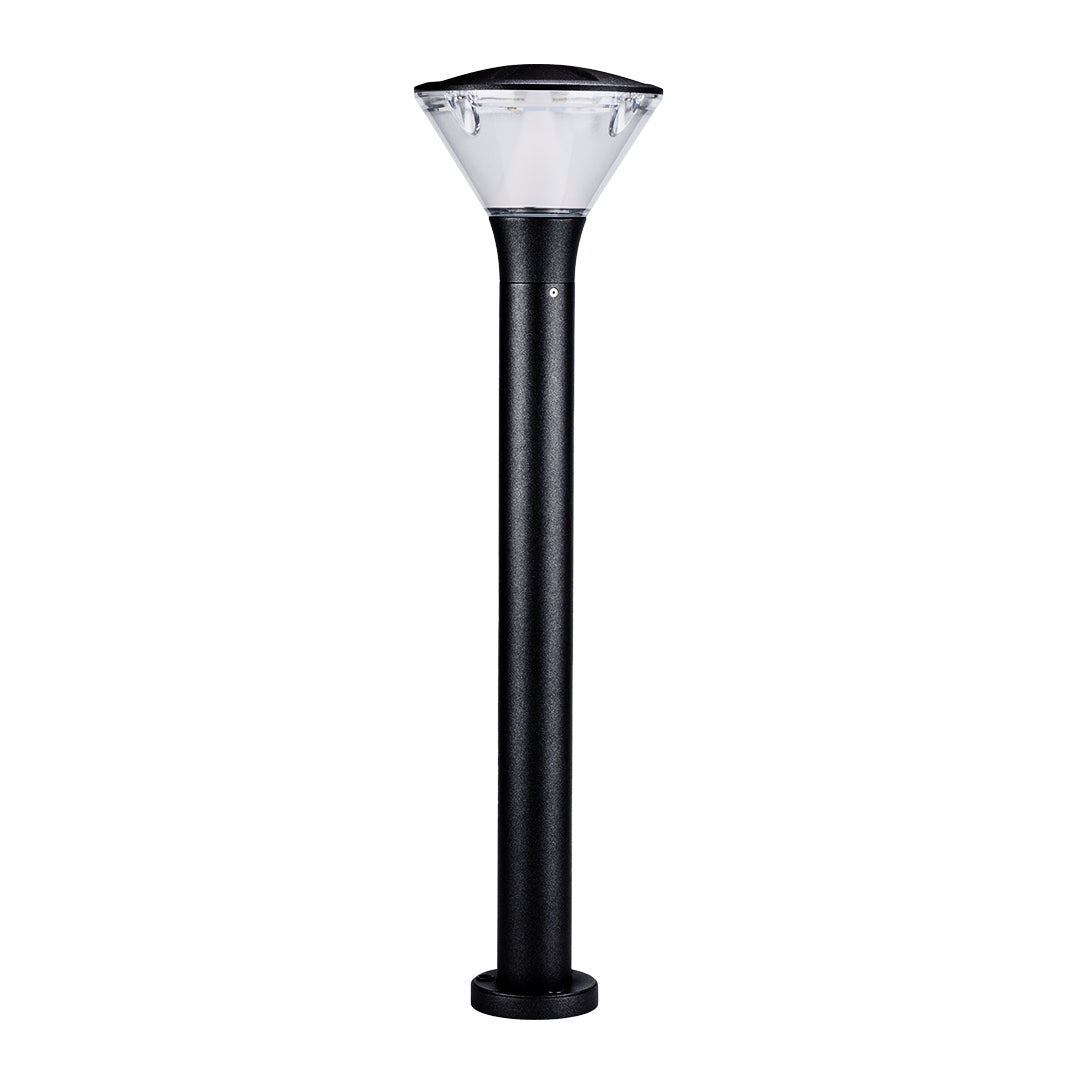 Bollard light providing warm ambient lighting along curved residential walkway
