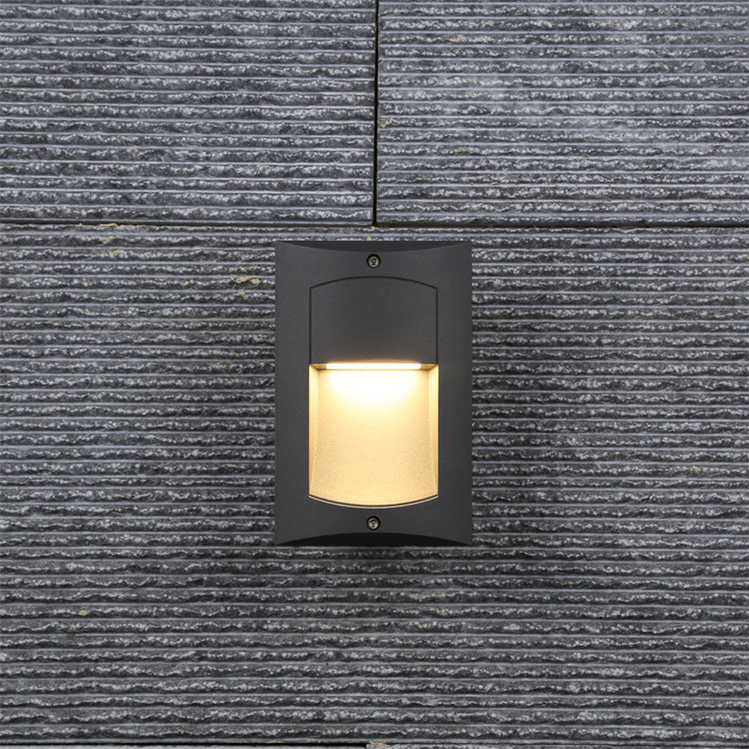 Contemporary recessed wall lighting integrated into concrete garden wall with landscape surroundings