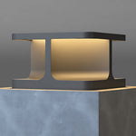Contemporary cubic post light with dual-tone finish creating ambient illumination in modern setting