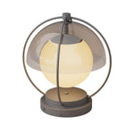 Contemporary globe light fixture with clear glass sphere and black metal ring frame