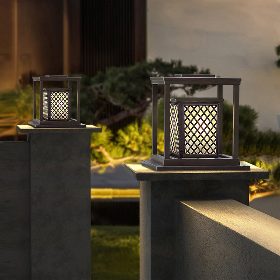 Angled view of contemporary outdoor light showing geometric panel construction and warm glow