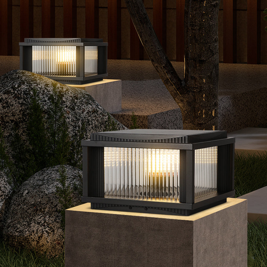 Contemporary solar deck light illuminating garden pathway with warm ambient lighting at dusk