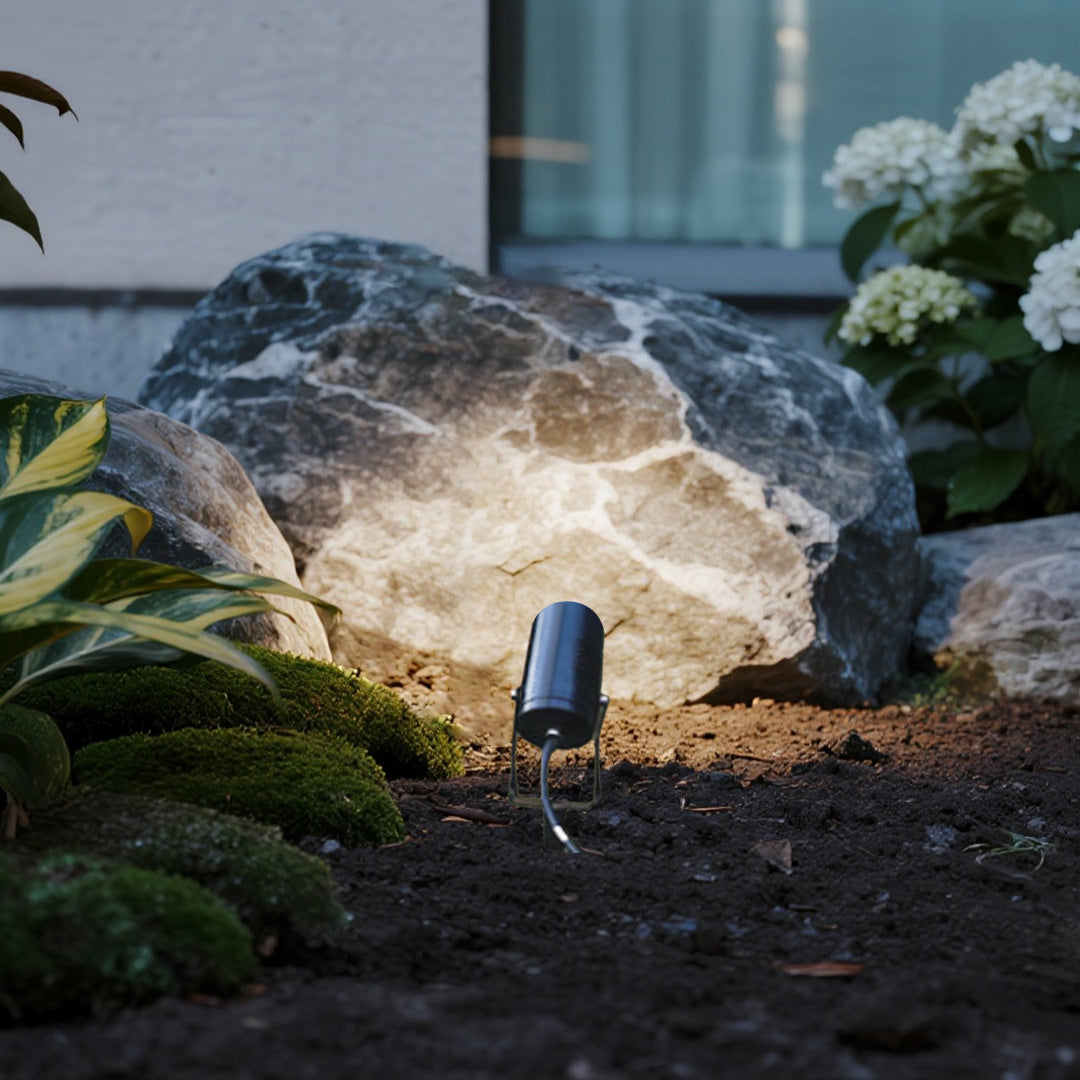 Contemporary stakes for landscape lights providing sophisticated illumination for modern home exterior