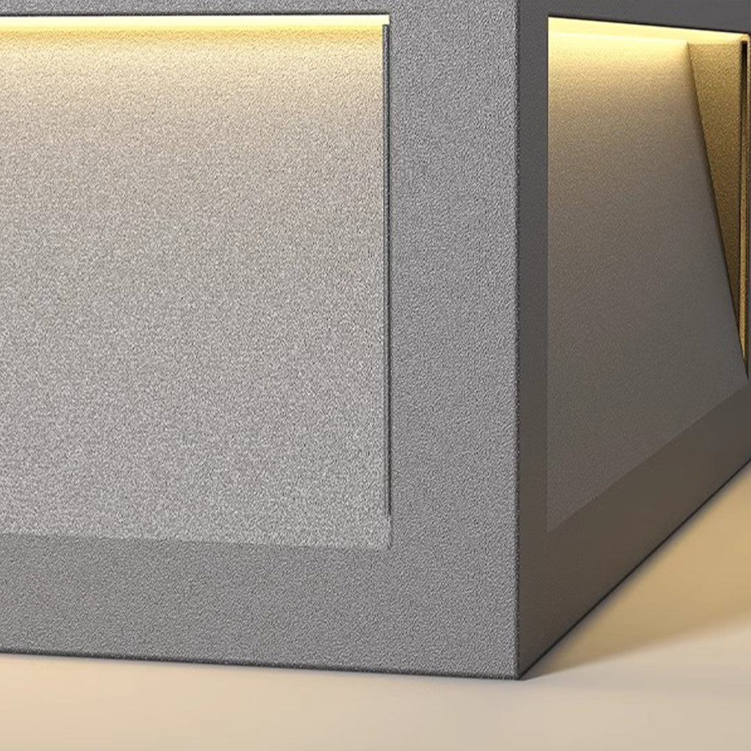 Modern cubic bollard light featuring sleek metal construction with integrated LED lighting for landscape design