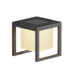 Contemporary cubic light fixture with geometric design creating soft ambient glow on white surface