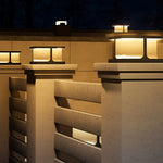 Contemporary cubic lighting fixtures integrated into modern architectural wall design for dramatic effect