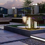 Designer lanterns illuminating contemporary outdoor space with clean architectural lines at twilight