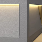 Modern cubic wall-mounted light fixtures creating dramatic architectural illumination on contemporary building facade at night