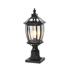 Elegant dark metal pedestal light featuring traditional lantern styling with decorative finial and clear glass