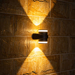 Sleek black angular wall light fixture with modern minimalist aesthetic