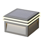 Modern cubic wall-mounted light fixtures creating dramatic architectural illumination on contemporary building facade at night