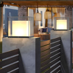Contemporary fence installation with illuminated cube post lights creating evening ambiance