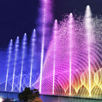 Close-up view of illuminated fountain jets with underwater LED lighting effects