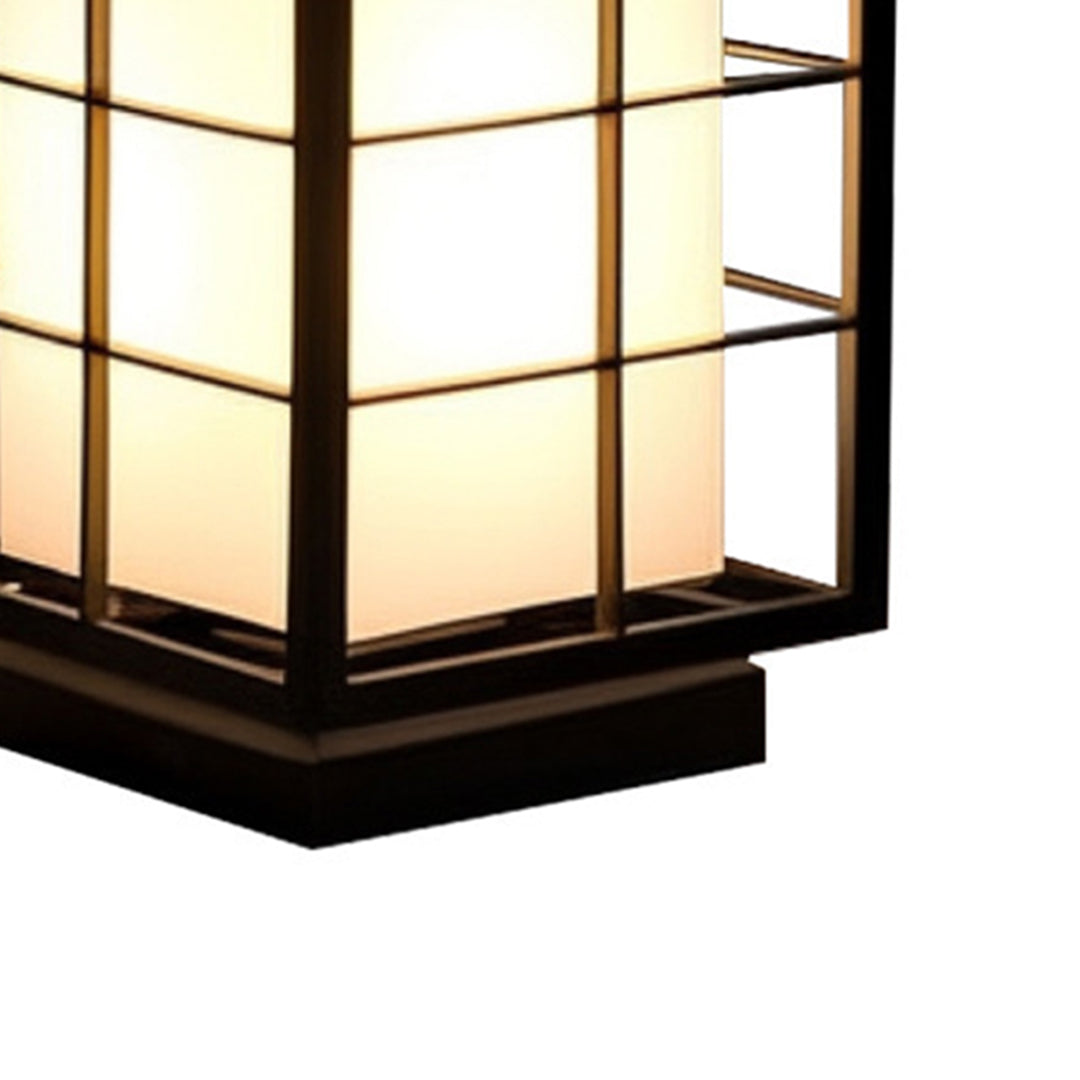 Illuminated geometric lantern with horizontal slats casting warm light in modern setting