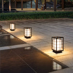 Several geometric lanterns placed along walkway creating pathway lighting design