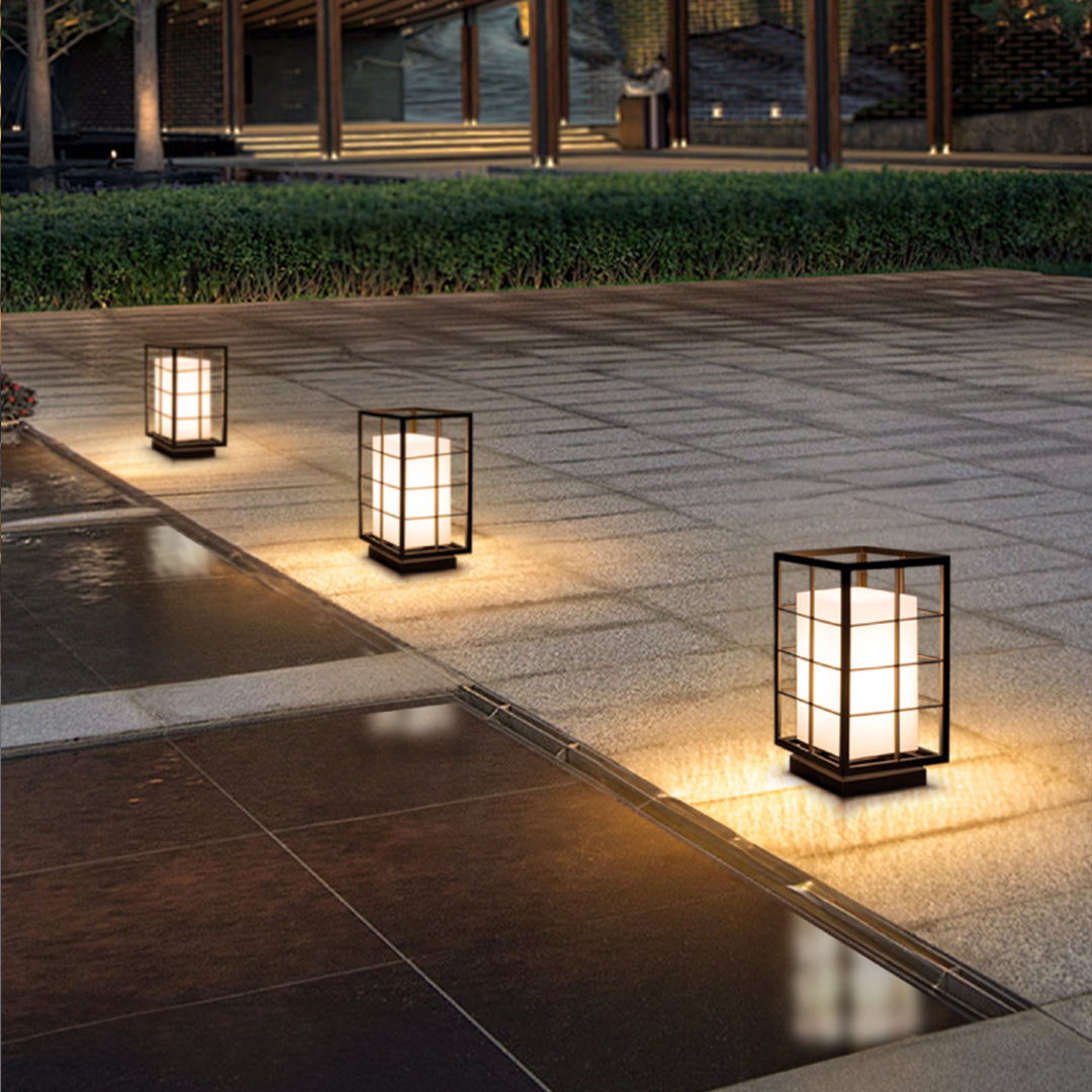 Several geometric lanterns placed along walkway creating pathway lighting design