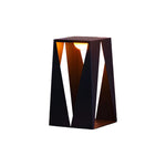 Angular black metal lantern with geometric cutout design and warm interior lighting