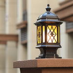 Heritage-style outdoor lantern with lattice glass design mounted on wooden deck post