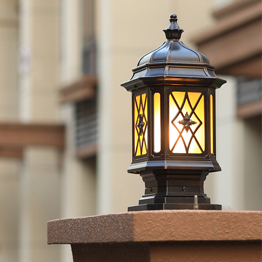 Heritage-style outdoor lantern with lattice glass design mounted on wooden deck post